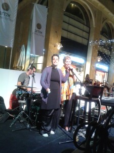 Shunamit sings along with folksinger at a singalong concert in Jerusalem