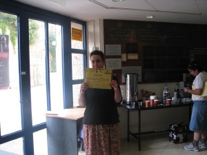 Shunamit with certificate in her apartment